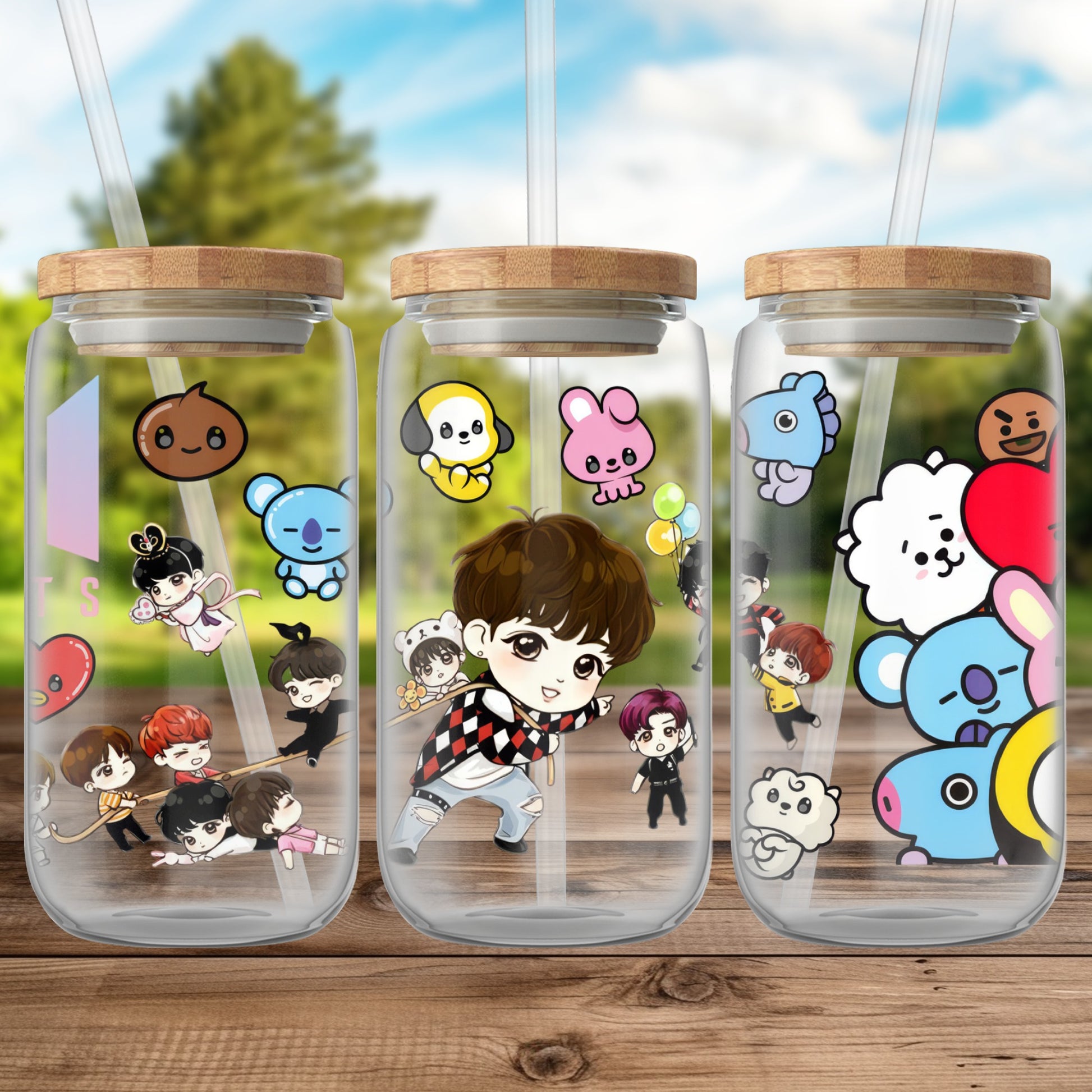 Three clear glass tumblers with BTS characters and logos.
