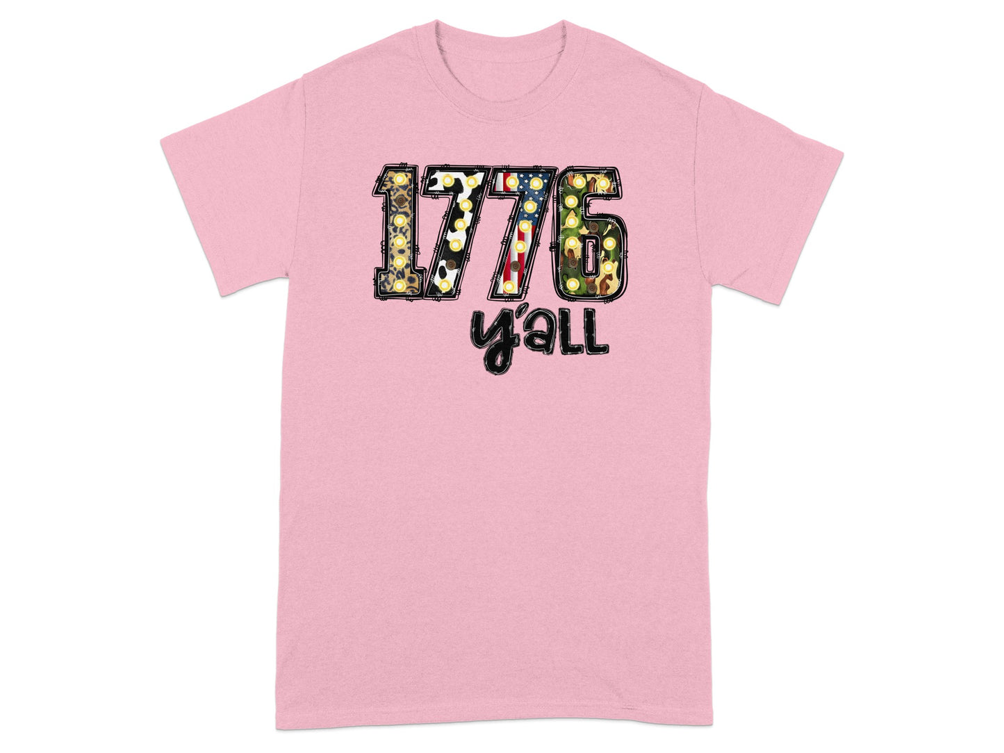 Pink t-shirt with "1776 y'all" graphic featuring American flag and patriotic patterns.